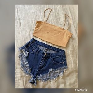 Distressed cheeky shorts